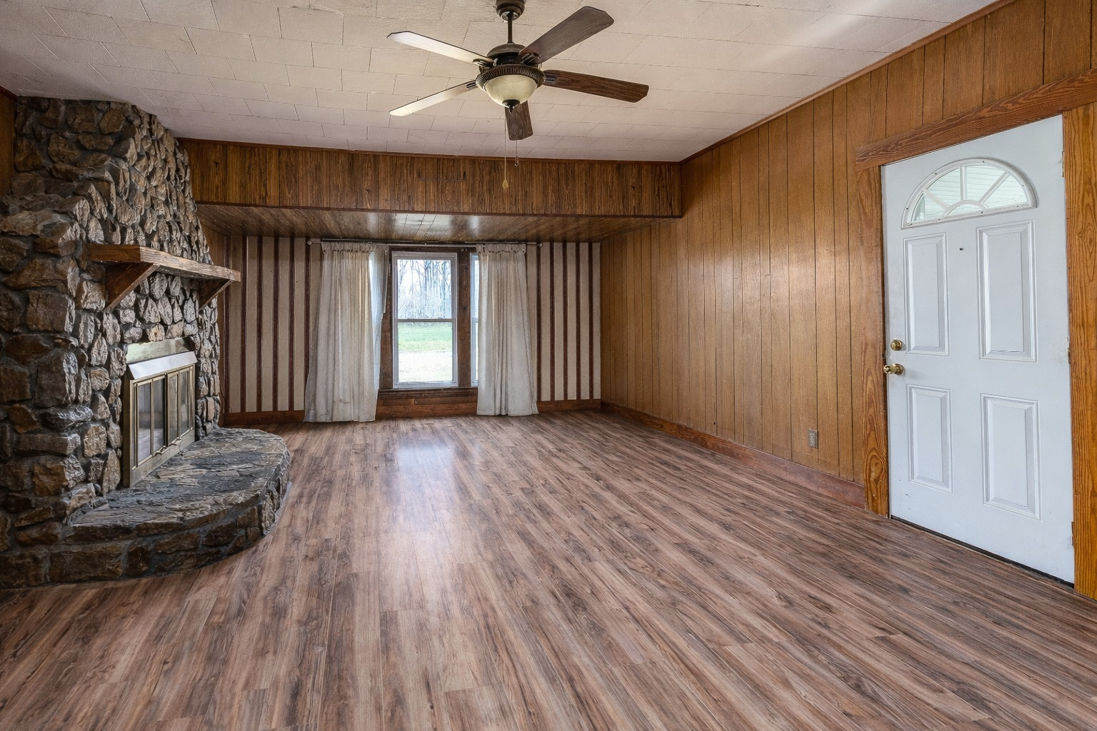 15016 Harmony Church Road West Frankfort, IL 62896 - Photo 6 of 31 wooden floor in an empty room with a window