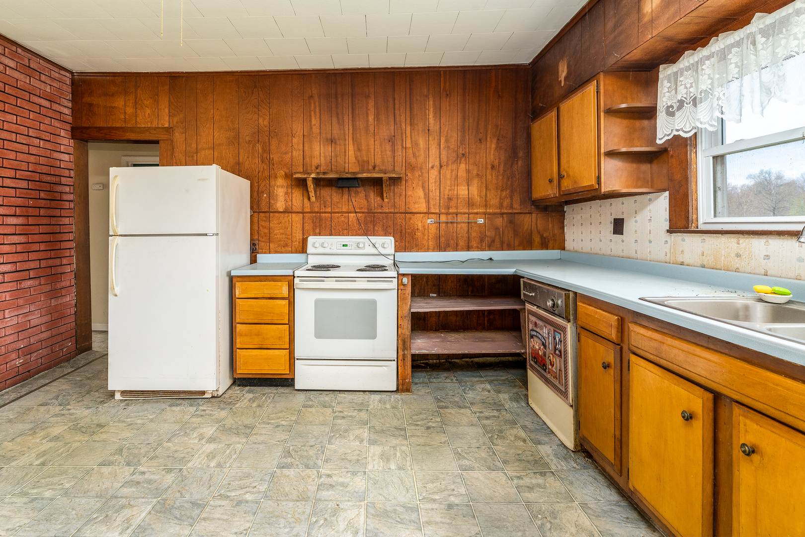 15016 Harmony Church Road West Frankfort, IL 62896 - Photo 10 of 31 a kitchen with a sink stove and cabinets