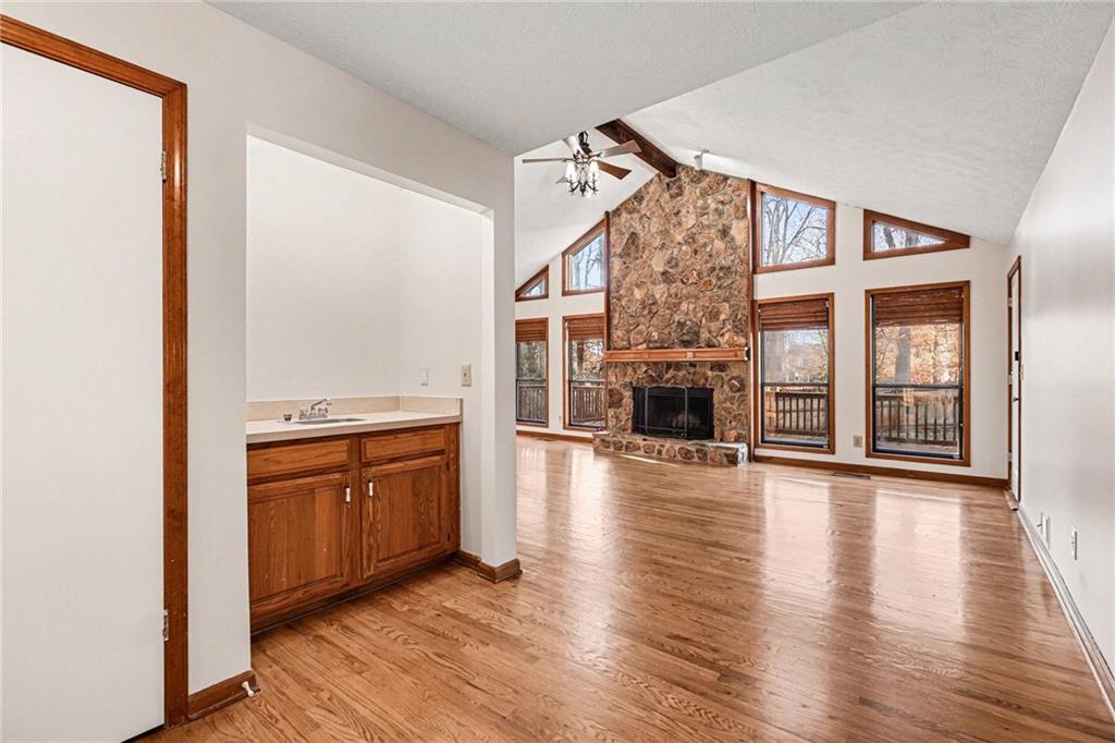 2711 Old Coach Road Duluth, GA 30096 - Photo 15 of 33 a view of a livingroom with wooden floor and a fireplace