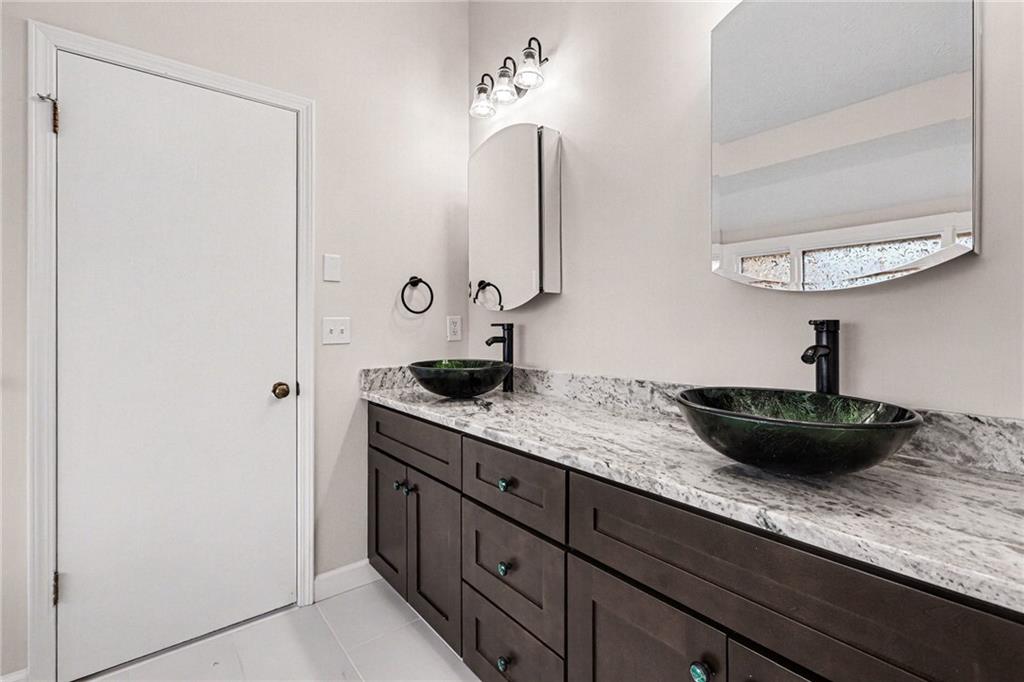 2711 Old Coach Road Duluth, GA 30096 - Photo 20 of 33 a kitchen with a sink and a refrigerator