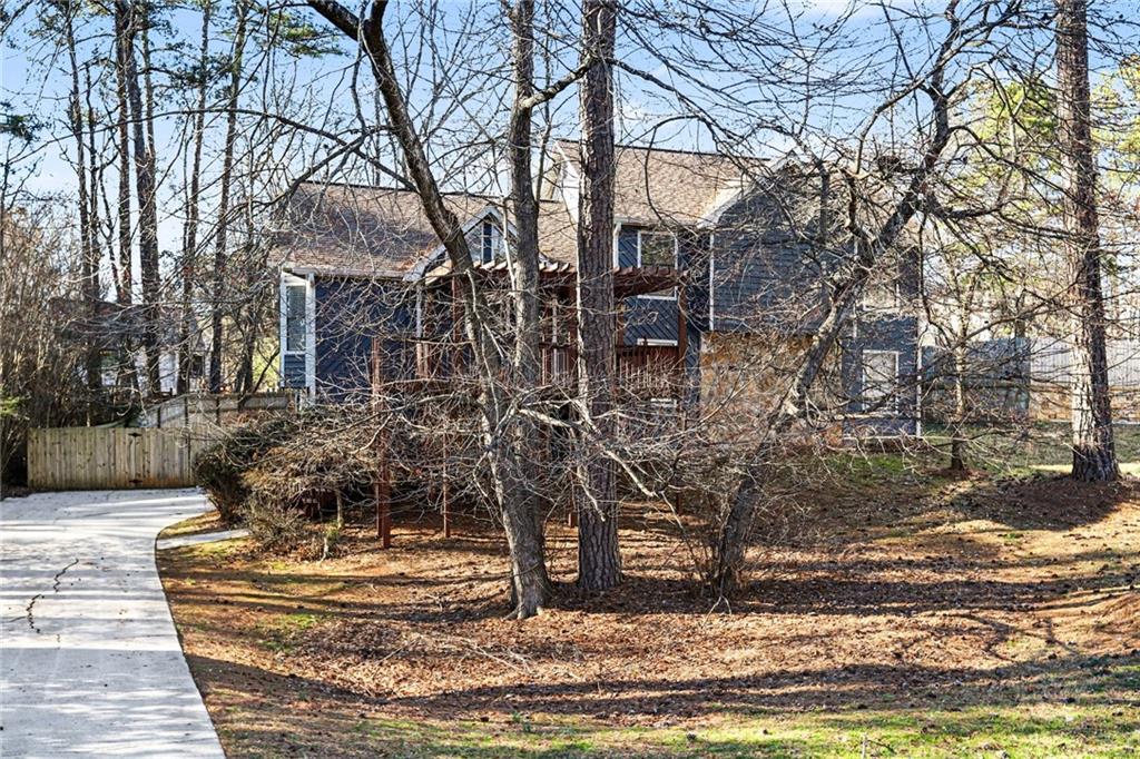 2711 Old Coach Road Duluth, GA 30096 - Photo 2 of 33 a view of a house with a yard