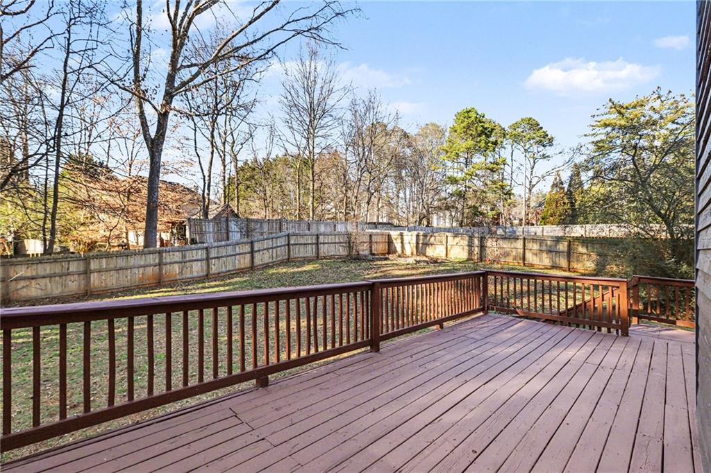 2711 Old Coach Road Duluth, GA 30096 - Photo 30 of 33 a view of a balcony with wooden floor