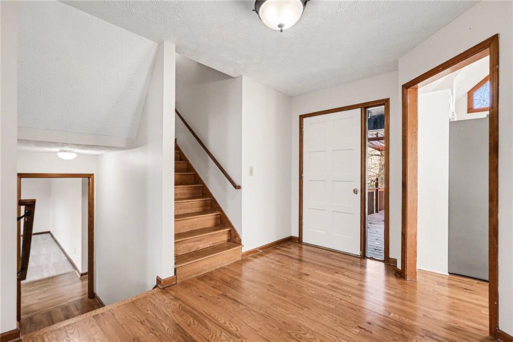 2711 Old Coach Road Duluth, GA 30096 - Photo 5 of 33 a view of a hallway with wooden floor and entryway