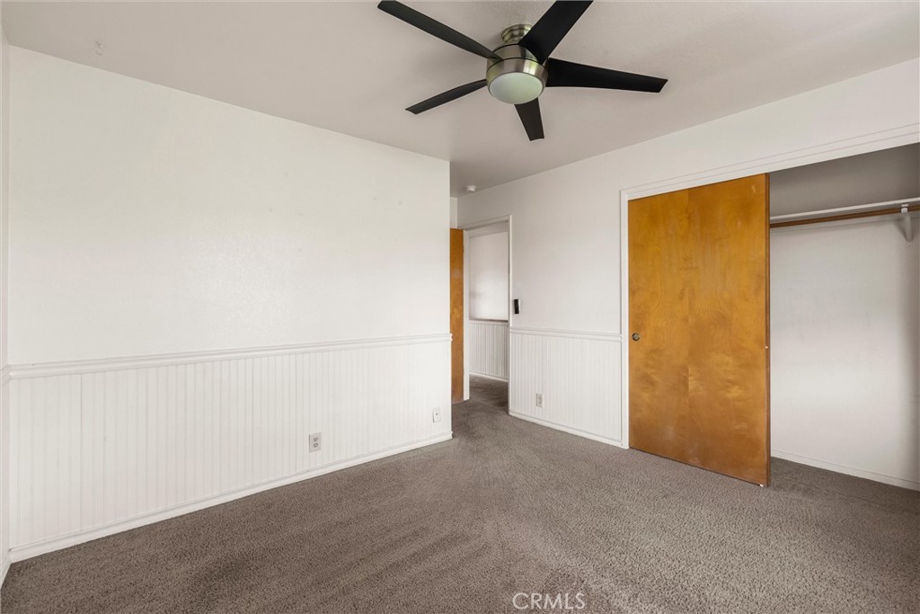 239 F Surf Street Morro Bay, CA 93442 - Photo 14 of 25 an empty room with a ceiling fan and a window