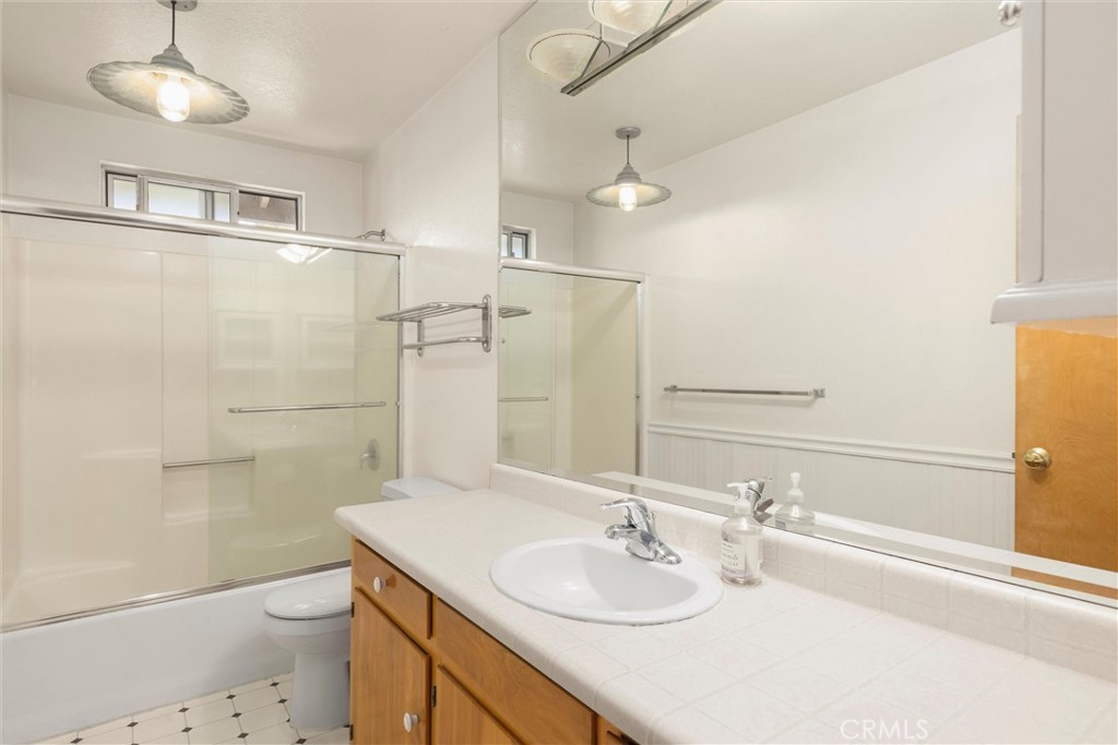 239 F Surf Street Morro Bay, CA 93442 - Photo 15 of 25 a bathroom with a granite countertop sink toilet and shower