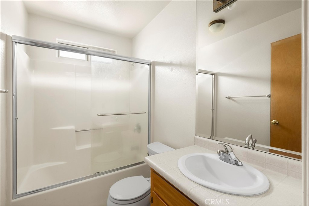239 F Surf Street Morro Bay, CA 93442 - Photo 18 of 25 a bathroom with a sink and a mirror