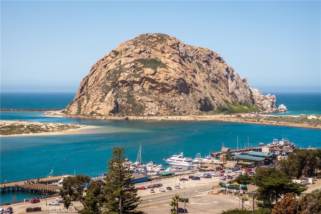 239 F Surf Street Morro Bay, CA 93442 - Photo 21 of 25 a view of a lake with a beach