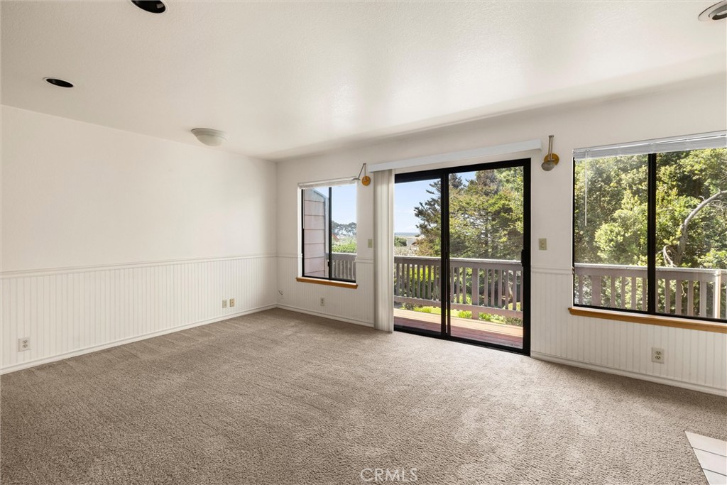 239 F Surf Street Morro Bay, CA 93442 - Photo 5 of 25 an empty room with windows