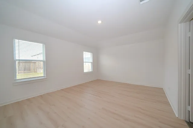 an empty room with windows