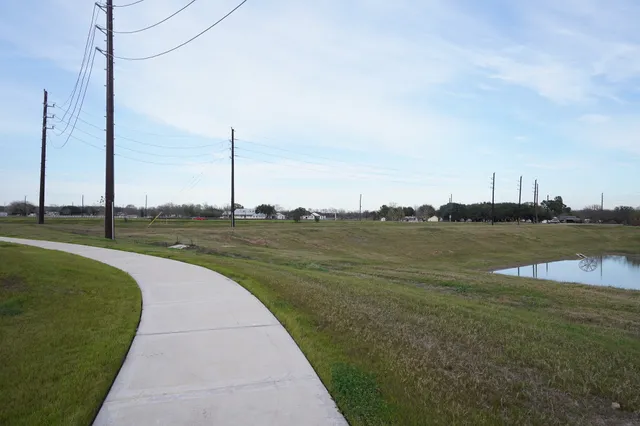 a view of a lake with houses in the back