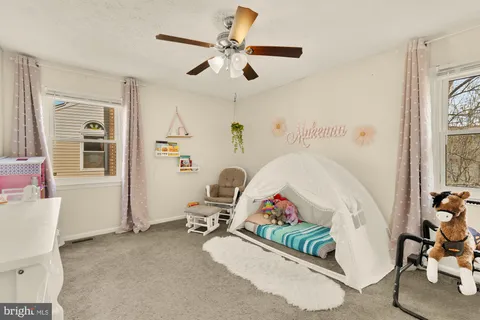 a bed room with furniture and a window