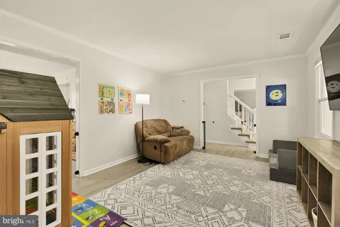 a spacious bedroom with a bed and furniture
