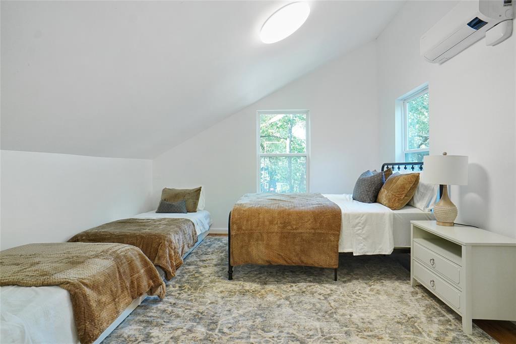 2147 Chaparral Gainesville, TX 76240 - Photo 25 of 40 a bedroom with two beds and painted walls