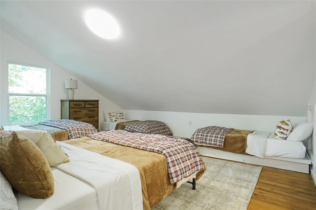 2147 Chaparral Gainesville, TX 76240 - Photo 27 of 40 a bedroom with a bed and a couch