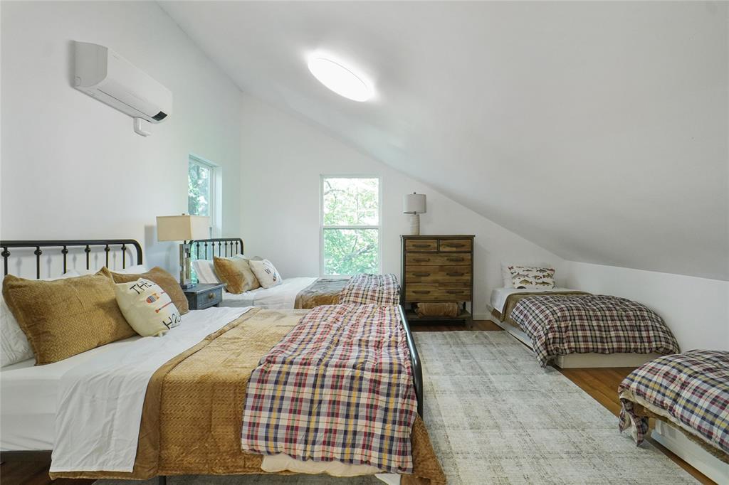 2147 Chaparral Gainesville, TX 76240 - Photo 28 of 40 a bedroom with a bed and a couch