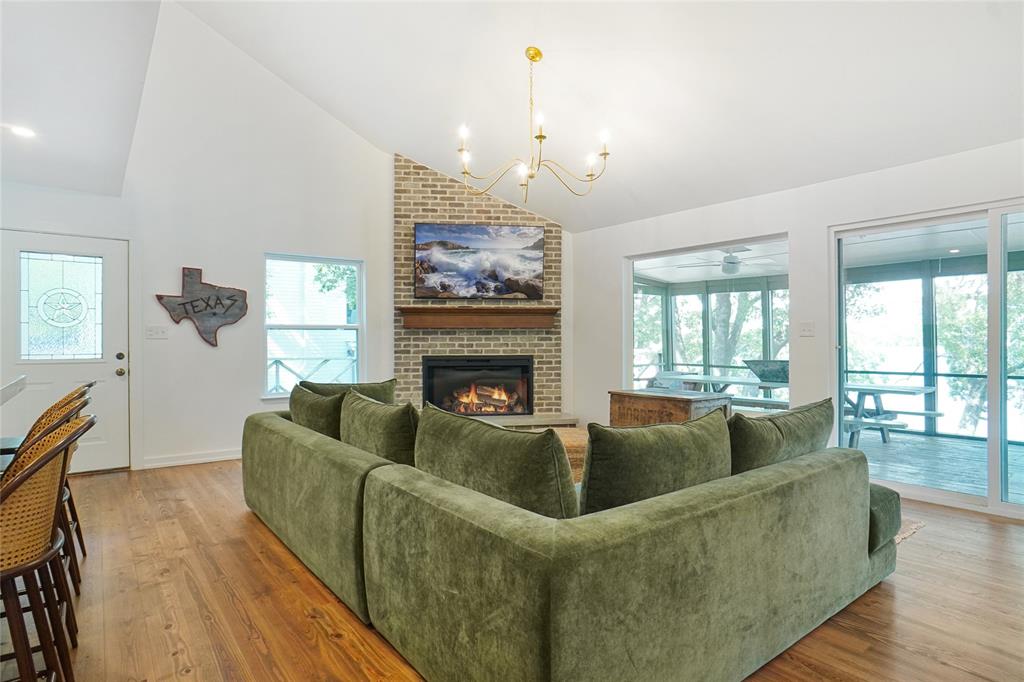 2147 Chaparral Gainesville, TX 76240 - Photo 4 of 40 a living room with furniture and a fireplace