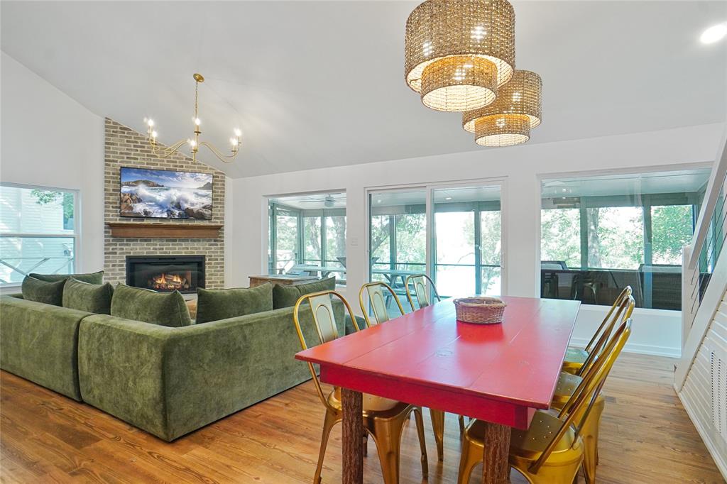 2147 Chaparral Gainesville, TX 76240 - Photo 10 of 40 a view of a dining room with furniture a chandelier and wooden floor