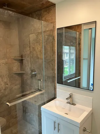 a bathroom with a sink and a mirror