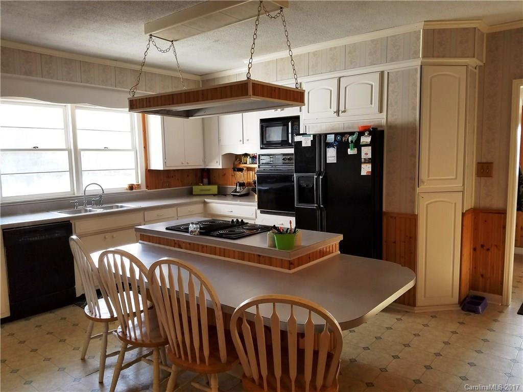 553 Cat Square Road Lincolnton, NC 28092 - Photo 2 of 24 a kitchen with stainless steel appliances granite countertop a stove a sink and a refrigerator