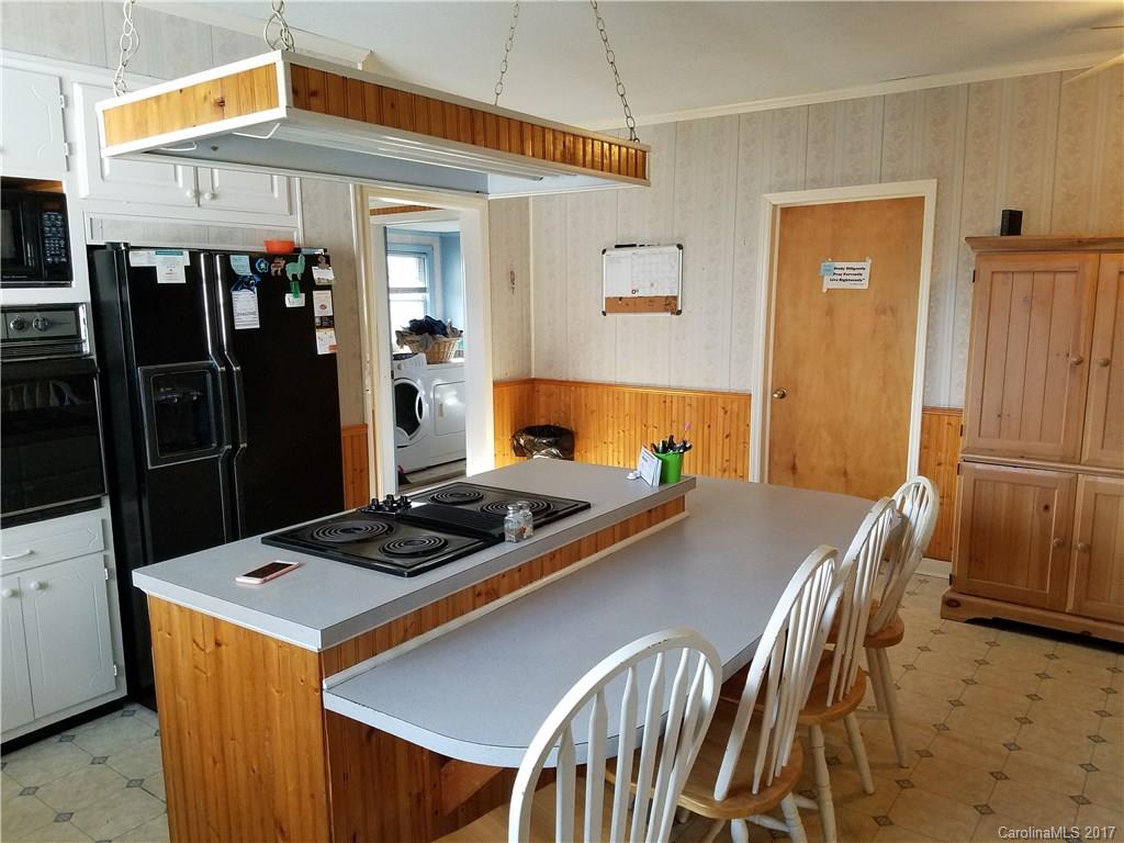 553 Cat Square Road Lincolnton, NC 28092 - Photo 4 of 24 a kitchen that has a stove and a refrigerator