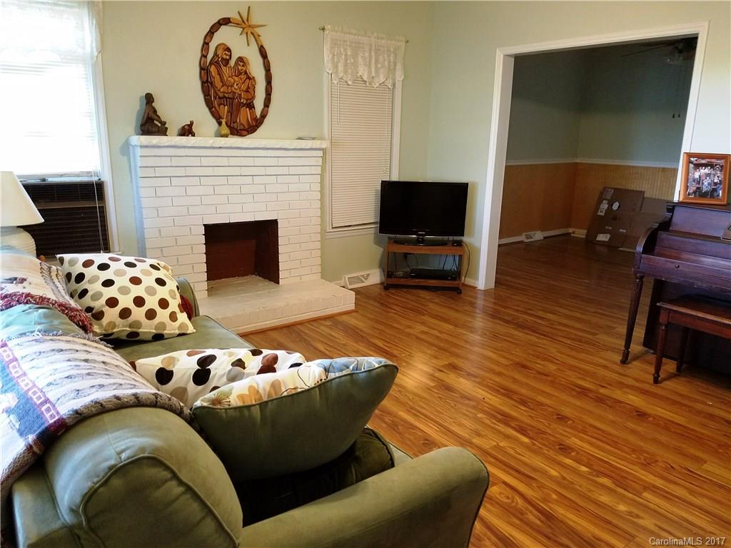 553 Cat Square Road Lincolnton, NC 28092 - Photo 8 of 24 a living room with furniture a flat screen tv and a fireplace