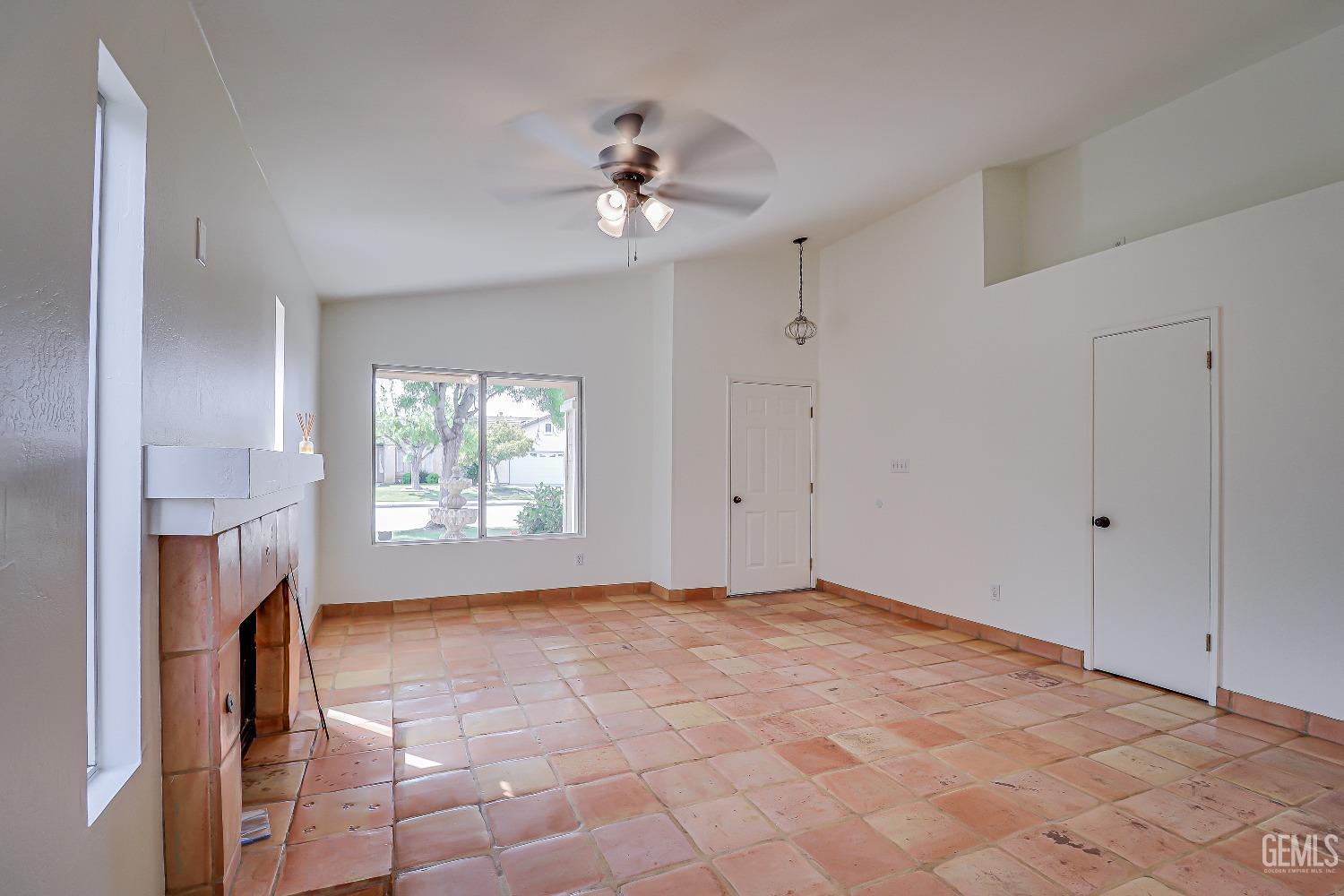 Undisclosed Address Bakersfield, CA 93312 - Photo 4 of 24 a view of empty room with a fireplace