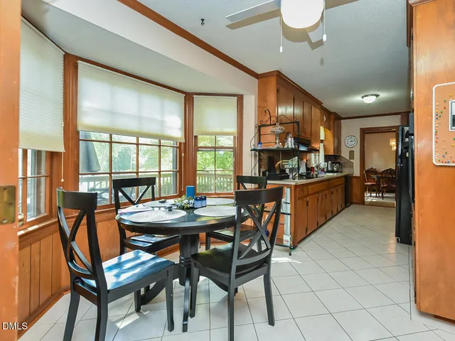 a dining room with furniture and window