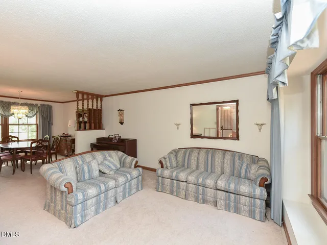 a living room with couches and a couch