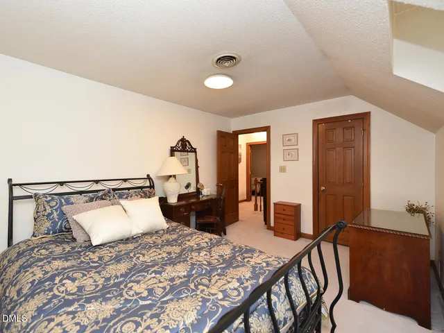 a bedroom with a bed and furniture