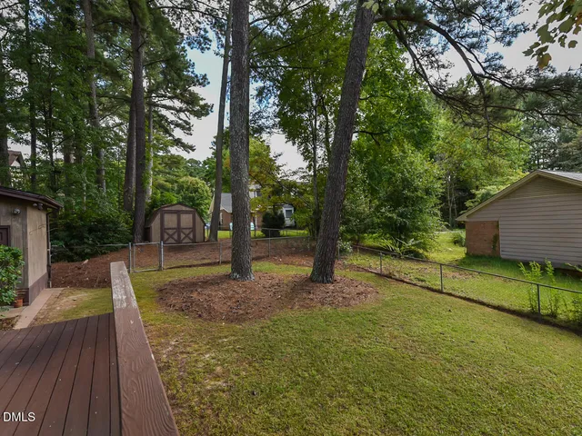 a view of a backyard with tree s