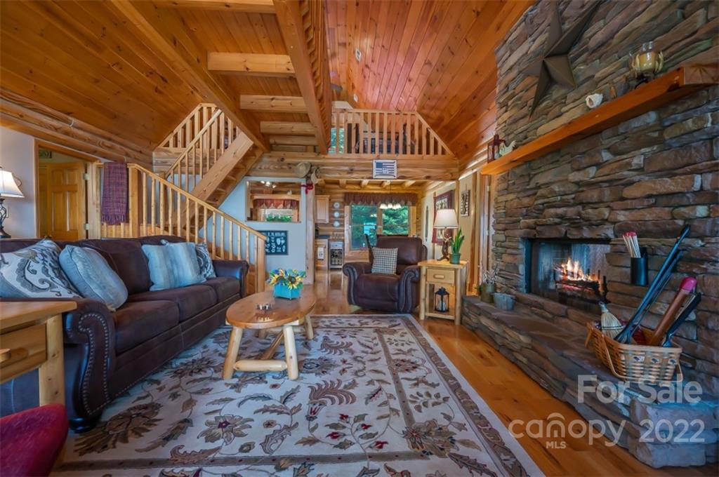 175 Big Rock Road Bostic, NC 28018 - Photo 15 of 45 a living room with furniture a fireplace and a wooden floor