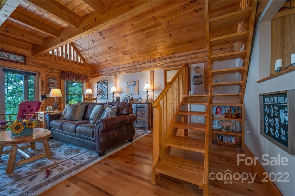 175 Big Rock Road Bostic, NC 28018 - Photo 18 of 45 a living room with furniture a ceiling fan and a rug