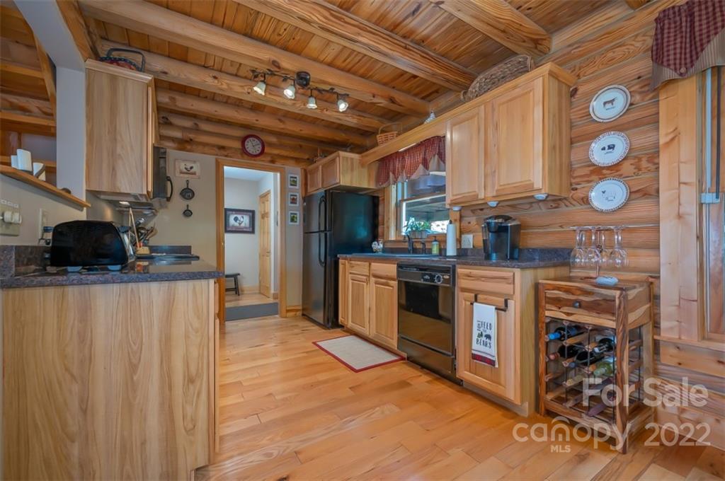 175 Big Rock Road Bostic, NC 28018 - Photo 20 of 45 a kitchen with stainless steel appliances granite countertop a stove a sink and a refrigerator