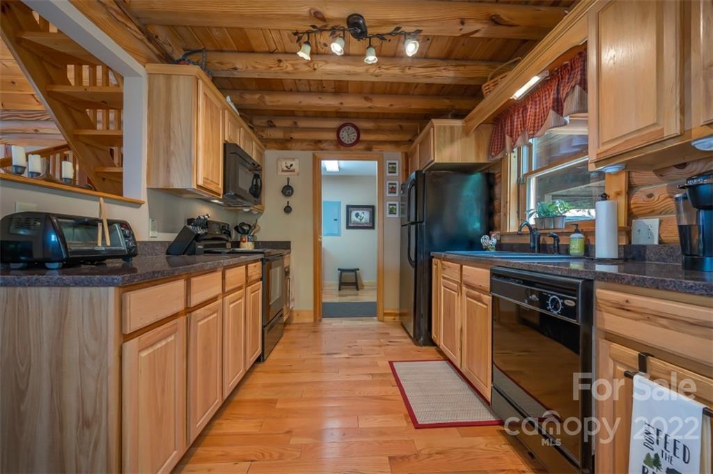 175 Big Rock Road Bostic, NC 28018 - Photo 21 of 45 a kitchen with stainless steel appliances granite countertop a stove a sink and a refrigerator