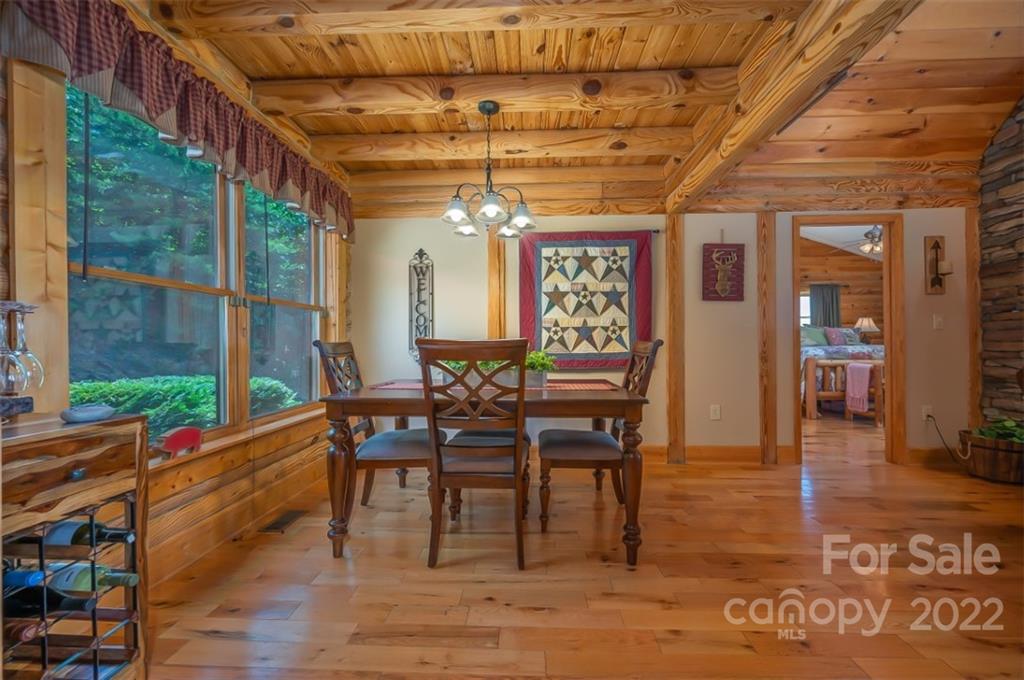 175 Big Rock Road Bostic, NC 28018 - Photo 24 of 45 a view of a dining room with furniture window and wooden floor