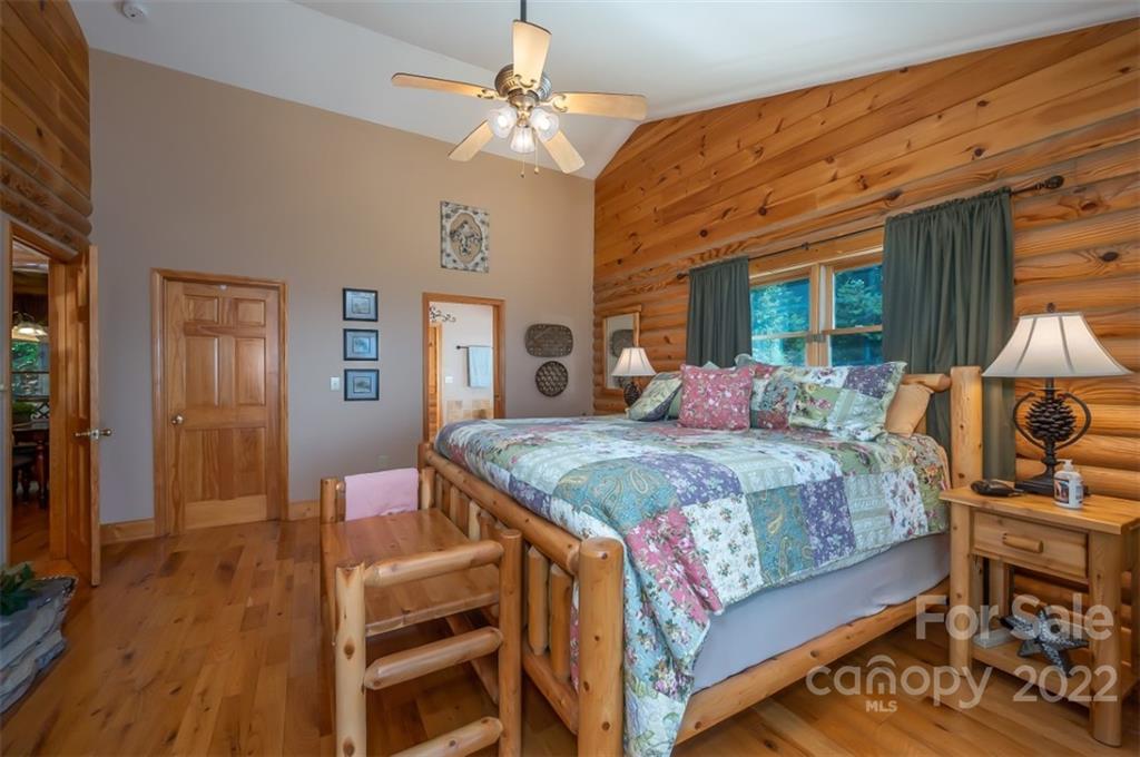 175 Big Rock Road Bostic, NC 28018 - Photo 27 of 45 a bedroom with a bed a dresser and wooden floor