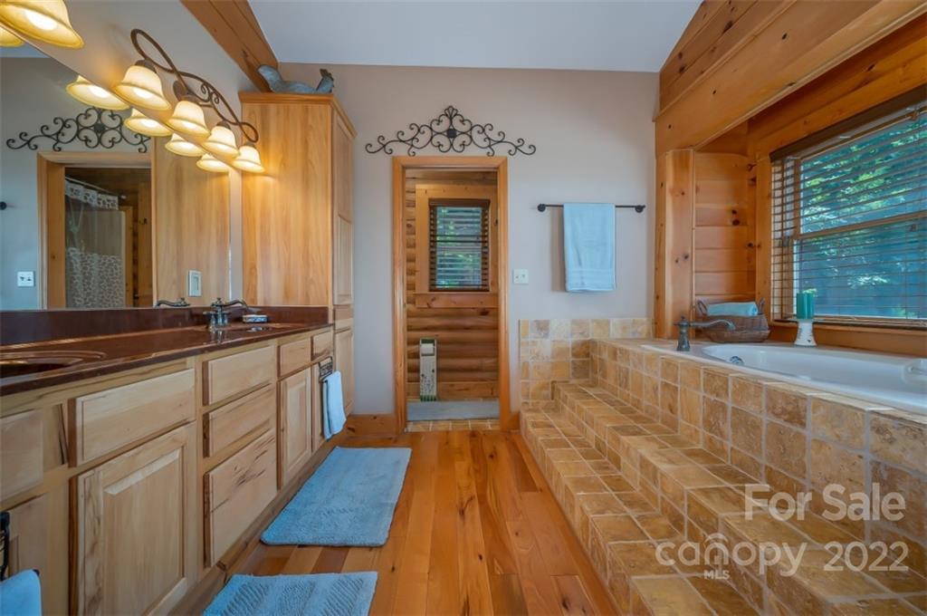 175 Big Rock Road Bostic, NC 28018 - Photo 28 of 45 a large bathroom with a sink and a large mirror