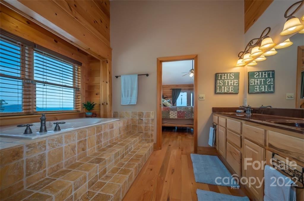 175 Big Rock Road Bostic, NC 28018 - Photo 30 of 45 a spacious bathroom with a tub and a sink