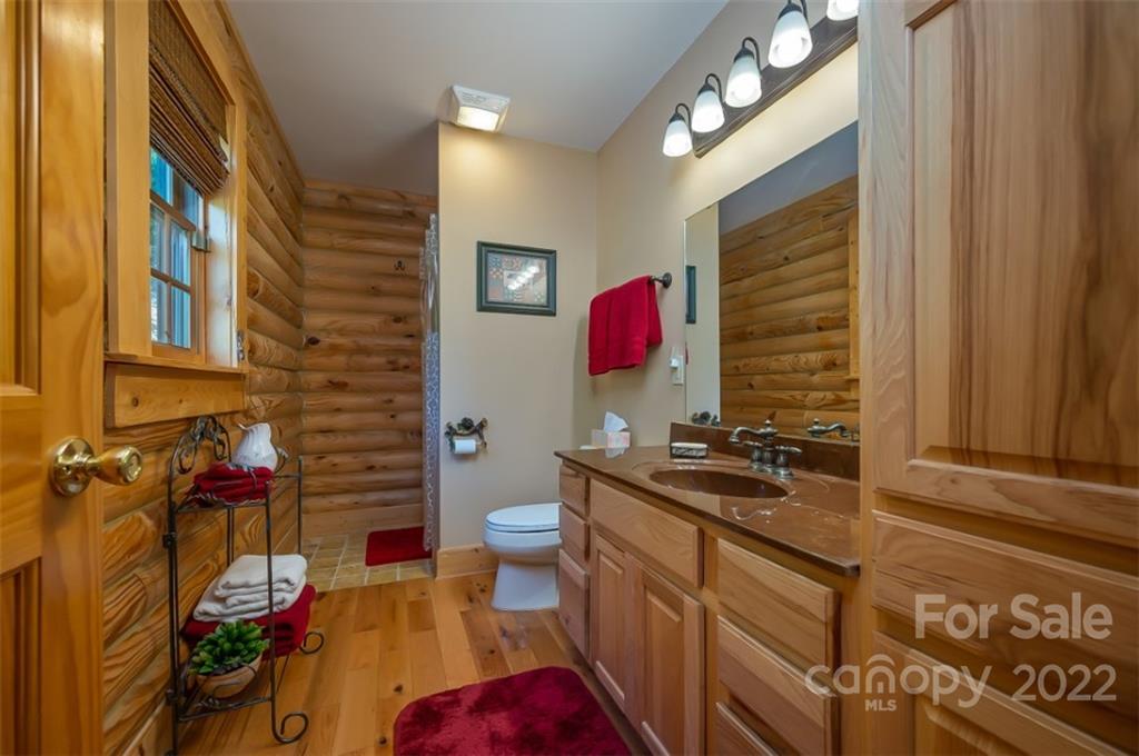 175 Big Rock Road Bostic, NC 28018 - Photo 33 of 45 a bathroom with a sink and a mirror