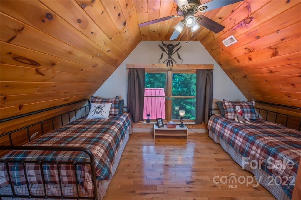 175 Big Rock Road Bostic, NC 28018 - Photo 34 of 45 a bed sitting in a bedroom next to a window