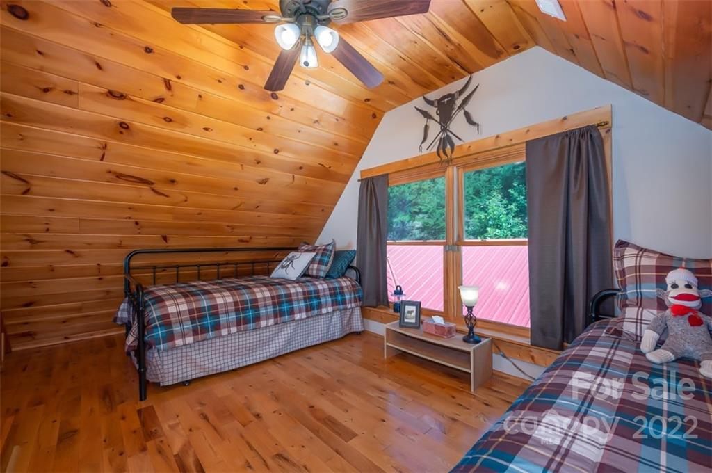 175 Big Rock Road Bostic, NC 28018 - Photo 35 of 45 a view of a bedroom with wooden floor and furniture