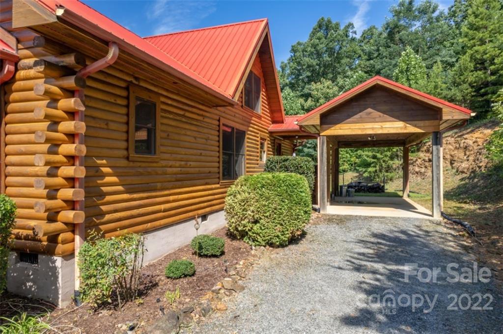 175 Big Rock Road Bostic, NC 28018 - Photo 9 of 45 a front view of a house with garden
