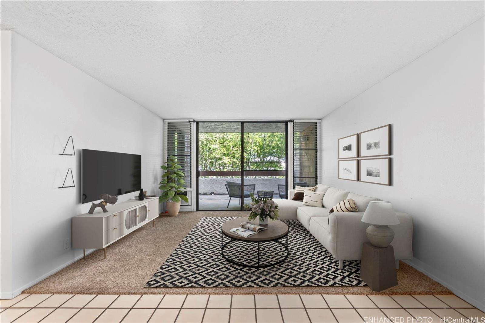 a living room with furniture and a flat screen tv
