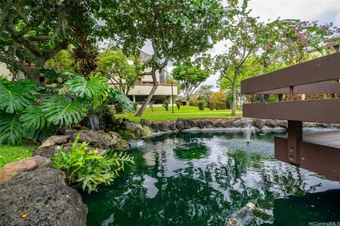 a view of a lake with a house in background