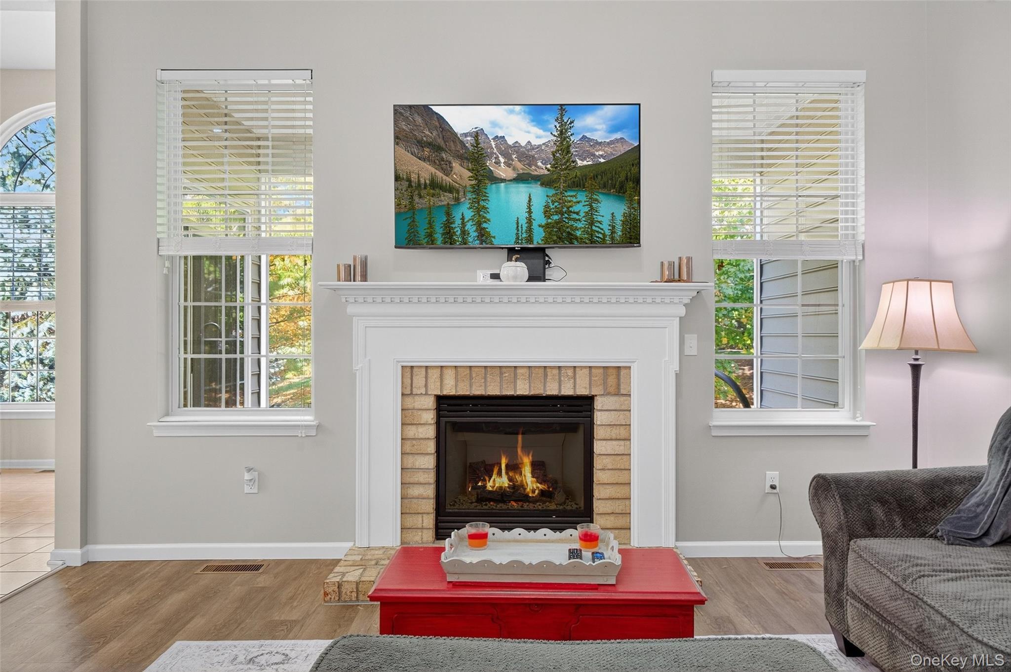 146 Stony Brook Road Fishkill, NY 12524 - Photo 5 of 12 Living area with wood finished floors, a fireplace, and plenty of natural light