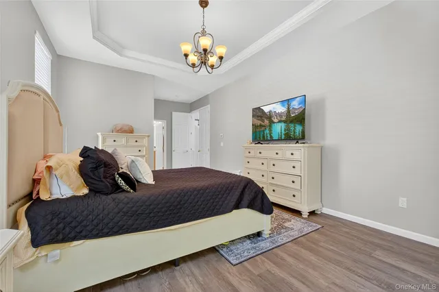 a bed room with a bed and a television