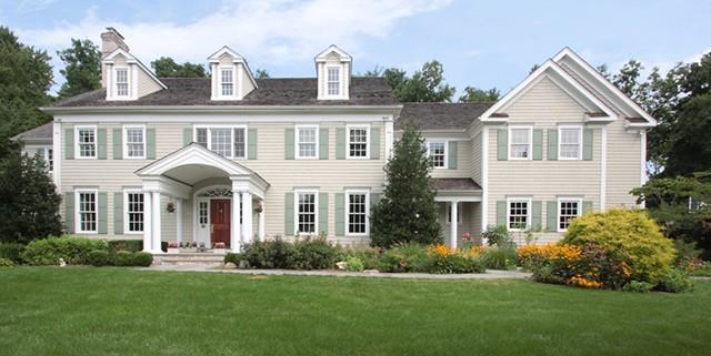 16 Marion Road Westport, CT 06880 - Photo 1 of 1 a front view of a house with a garden and plants
