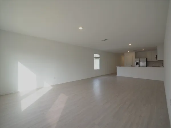 a view of a kitchen with a sink and a window