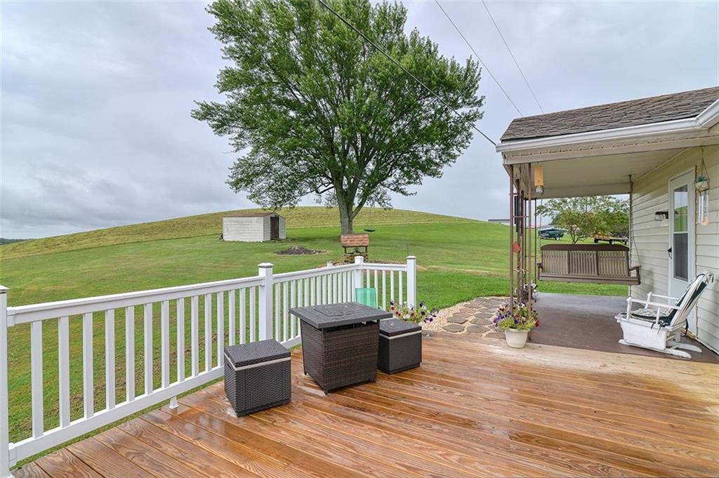 680 Dry Ridge Road West Alexander, PA 15376 - Photo 16 of 19 a view of a deck with chairs and floor to ceiling window