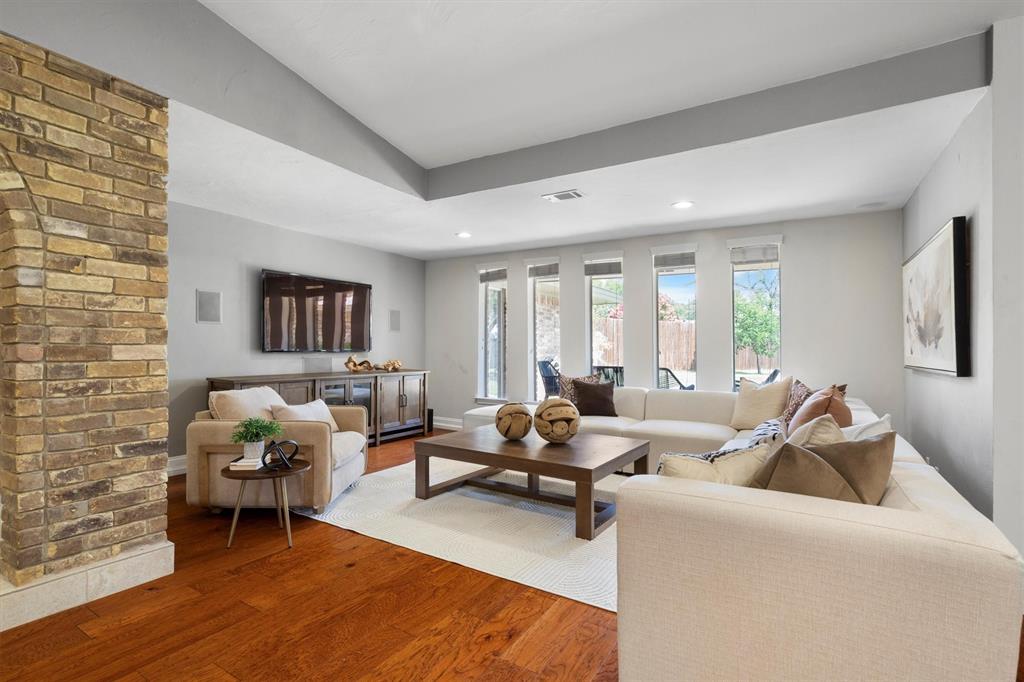2016 Pembrooke Place Denton, TX 76205 - Photo 12 of 40 a living room with furniture and wooden floor